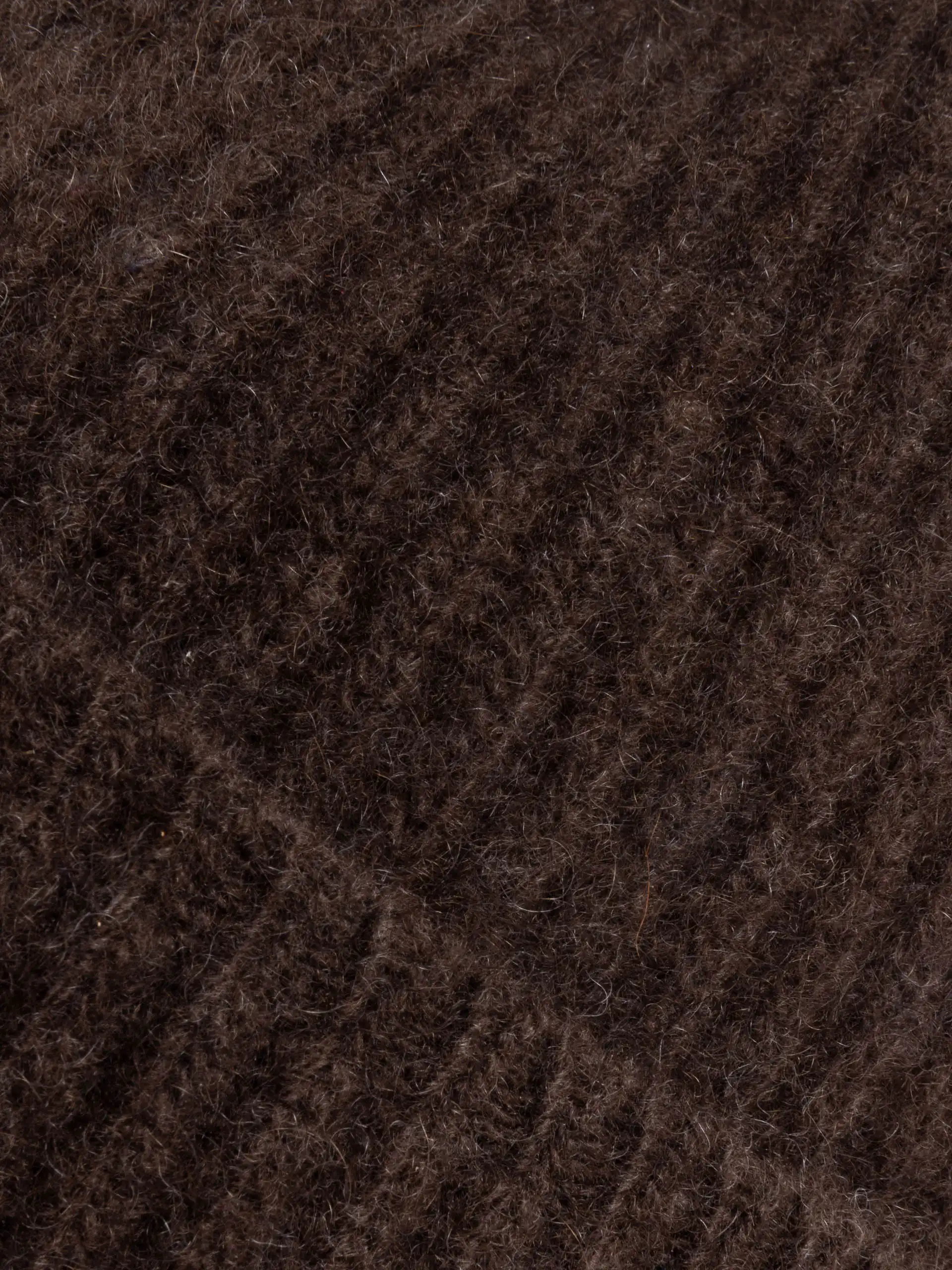 Gros plan du tissu utilisé pour le BONNET YACK Marron foncé, mettant en évidence la texture et la qualité